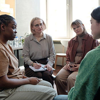licensed clinician and student observing therapy session